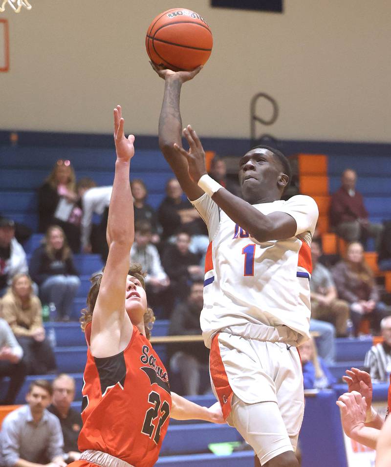 Genoa-Kingston's Joshua Bunting shoots over Sandwich's Austin Marks Thursday, Jan. 5, 2023, during their game at Genoa-Kingston High School in Genoa.