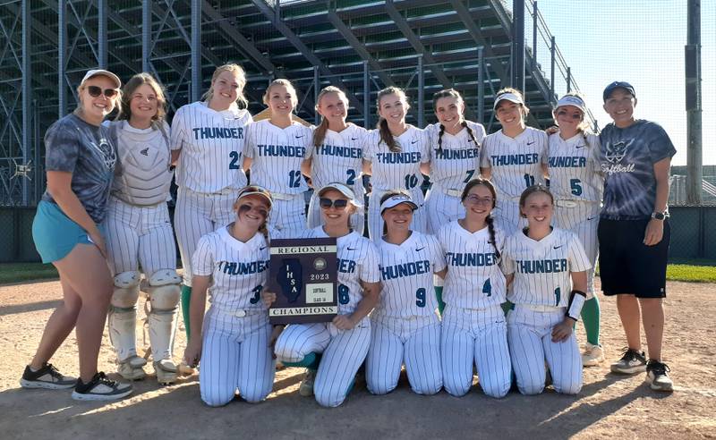 The Woodstock North softball team poses with its freshly won regional championship plaque Friday, May 26, 2023.