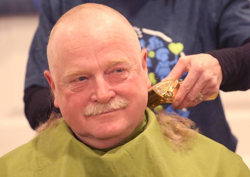 Ralph Moshage of Waltham, has his head shaved during the 18th annual Illinois Valley Emergency Services St. Baldrick's event on Sunday, March 23, 2025 at Senicas Oak Ridge in La Salle.
