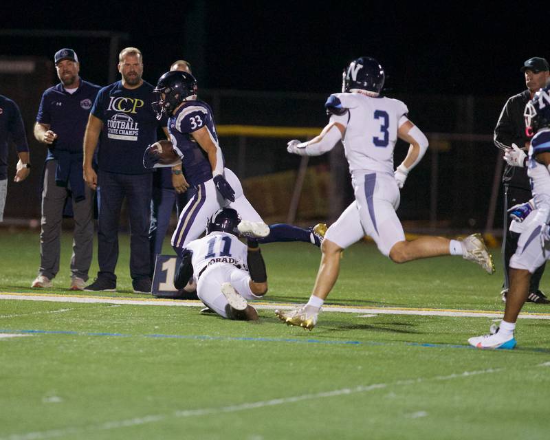 IC Catholic's Joey Gliatta runs the ball for a gain against Nazareth  on Friday, Sept.15,2023 in Elmhurst.