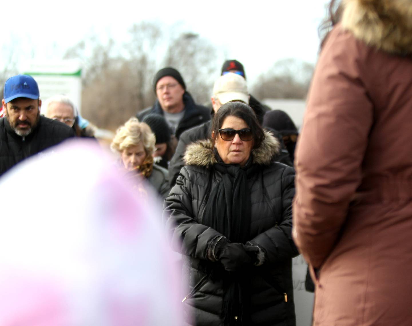 Maria Faso, aunt of Maria Abbinanti, listens as a prayer is read during a rally in honor of Sebastian and Maria Abbinanti outside AMITA Health St. Joseph Hospital in Elgin on Wednesday, Dec. 22, 2021 after a Kane County judge denied a request to allow the drug Ivermectin be administered. Maria Abbinanti passed away in the early morning hours of Wednesday, Dec. 22, 2021 and her husband, Sebastian, is still hospitalized.