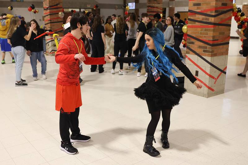 Miko Perez and Emily Vargas share a dance at the annual Special Population Dance hosted by Joliet West high school on Friday, March 22, 2024.