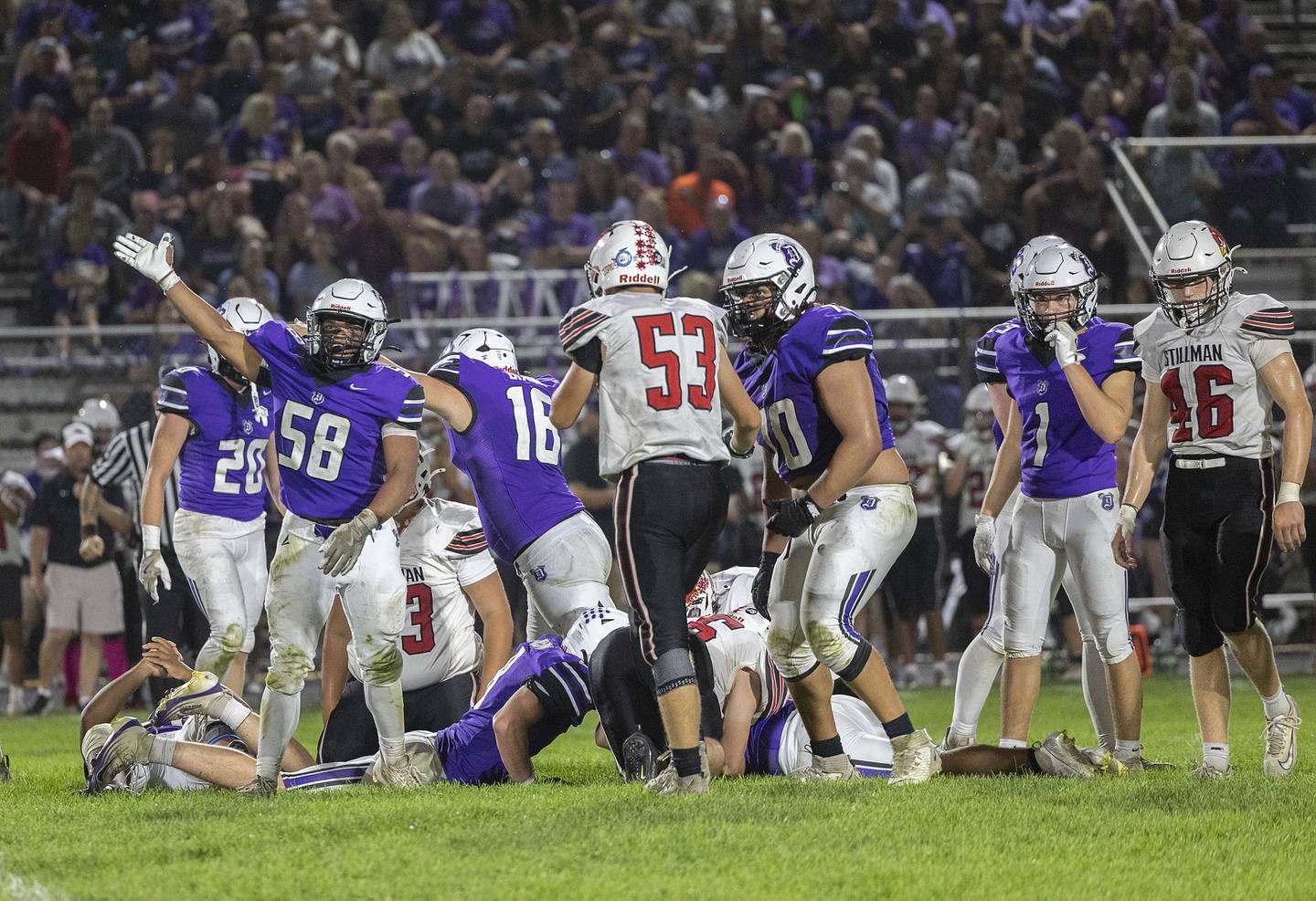 The Dixon defense celebrate a turnover against Stillman Valley Friday, Oct. 3, 2025.