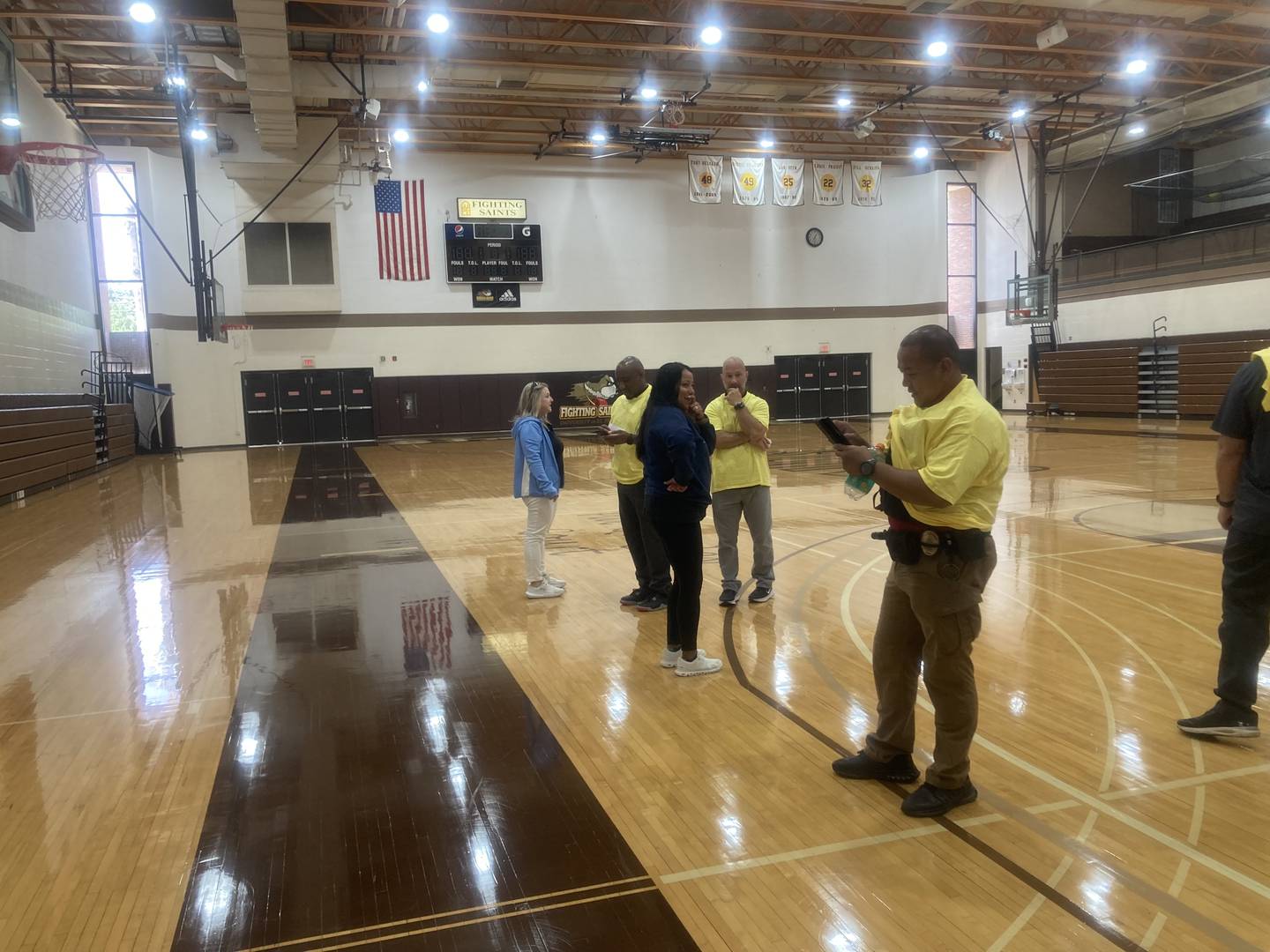 Reunification drill participants representing students wait in the University of St. Francis gym to be picked up by their designated "guardians" during an emergency training program for first responders and local school personnel at University of St. Francis in Joliet on Wednesday, July 23, 2025.