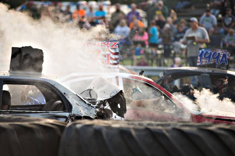 Cars smoke and sputter as the sun starts to set at Peat Monster in Morrison Saturday night.