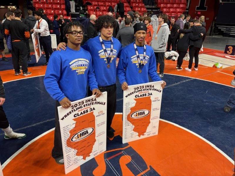 Aaron Stewart (from left), Royce Lopez and Caleb Noble placed the IHSA 3A State Championships. Stewart was the champion at 175 pounds, Noble was the champion at 113 pounds, and Lopez placed fifth at 165 pounds.