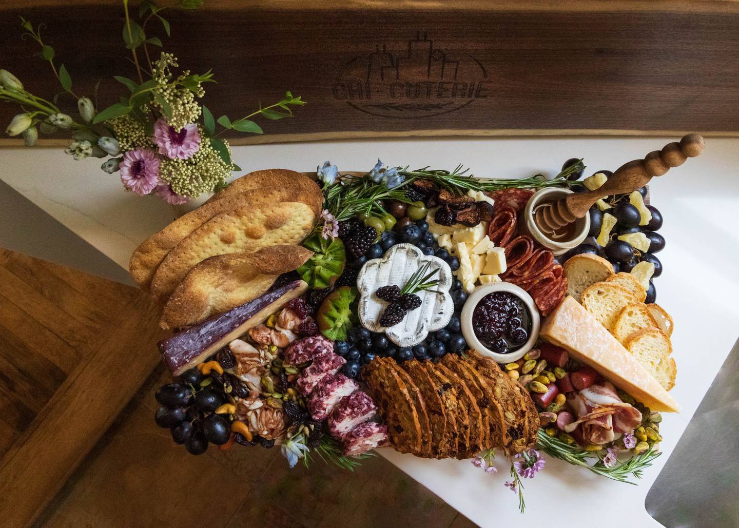A sample charcuterie featuring meats, cheeses, crackers, fruit and nuts, as created by Chi-Cuterie Boards and More, 321 Franklin St., Geneva.