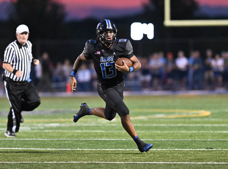 Lincoln-Way East's Jonas Williams runs for a first down during a non-conference game against Maine South on Friday, Aug. 30, 2024, at Frankfort. (Dean Reid for Shaw Local News Network)