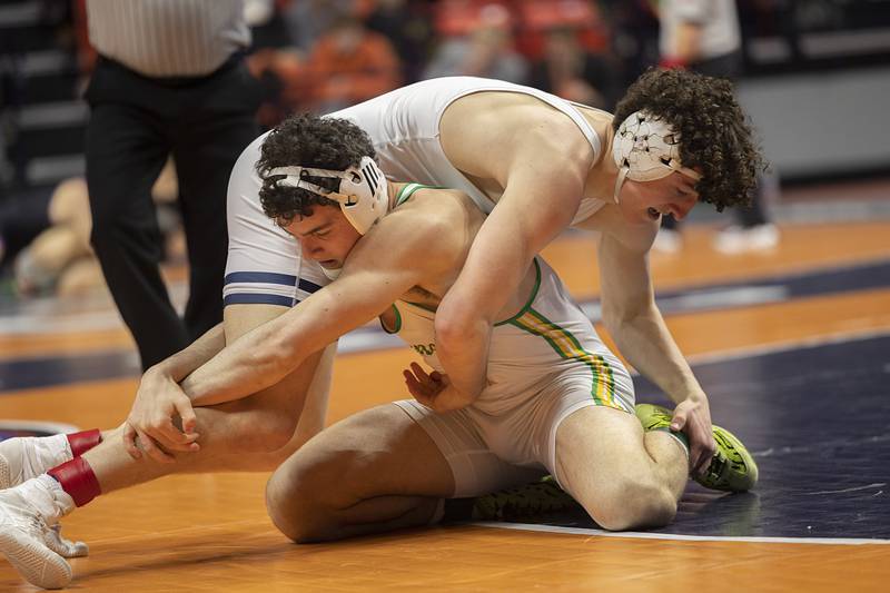 IC Catholic’s Brody Kelly works against Geneseo’s Kye Weinzierl in the 2A 175 class Saturday, Feb. 21, 2026, at the IHSA wrestling finals in Champaign.