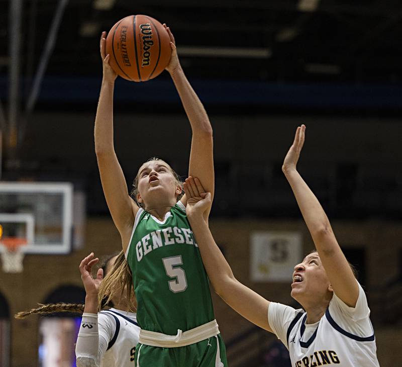 Geneseo’s Addison Snodgrass pulls down a rebound over Sterling’s Kirra Gibson Thursday, Dec. 7, 2023.