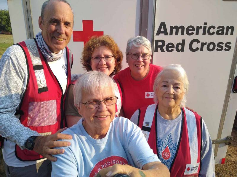 Army retiree and Long Point native Joyce Cook (front) pauses with her American Red Cross co-workers during their volunteer work on the Hawaiian island of Maui in September.