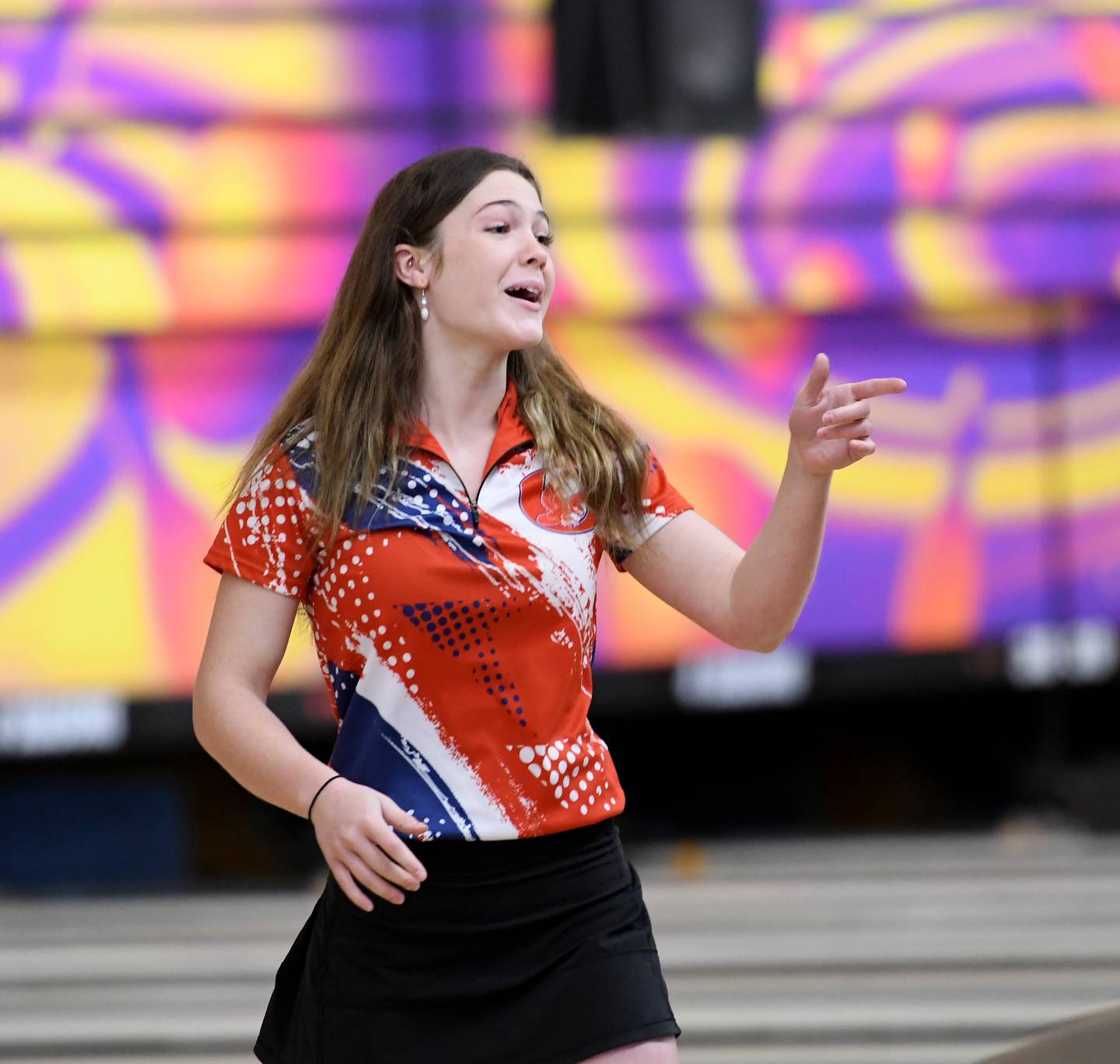 Oregon's Ava Wight reacts with her teammates after rolling a strike at the Freeport Regional on Saturday, Feb. 4.