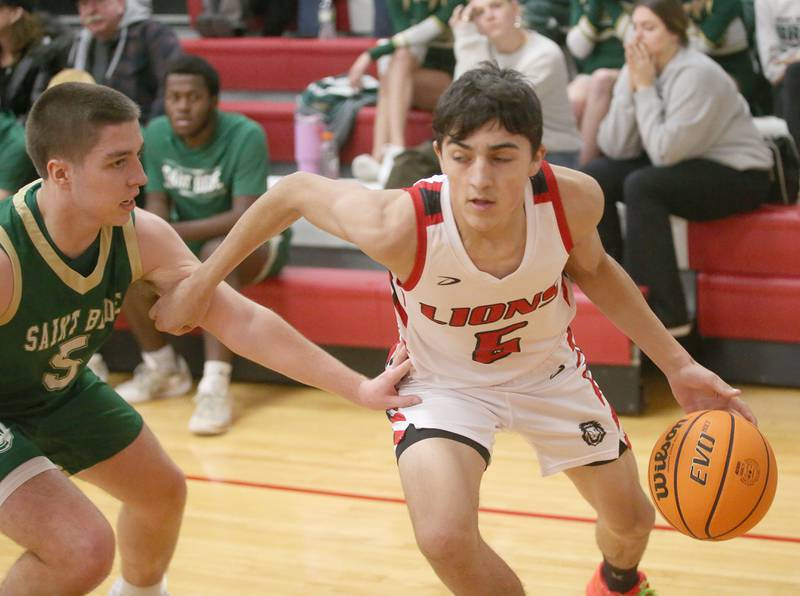 LaMoille's Brayden Fischer gets around St. Bede's Halden Hueueburg on Tuesday, Feb. 11, 2025 at LaMoille High School.