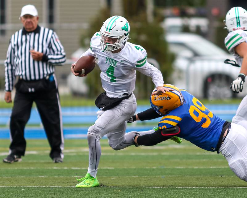 York's Sean Winton avoids Lyon's Kellen Knop (99) during football game between York at Lyons.   Oct 14, 2023.