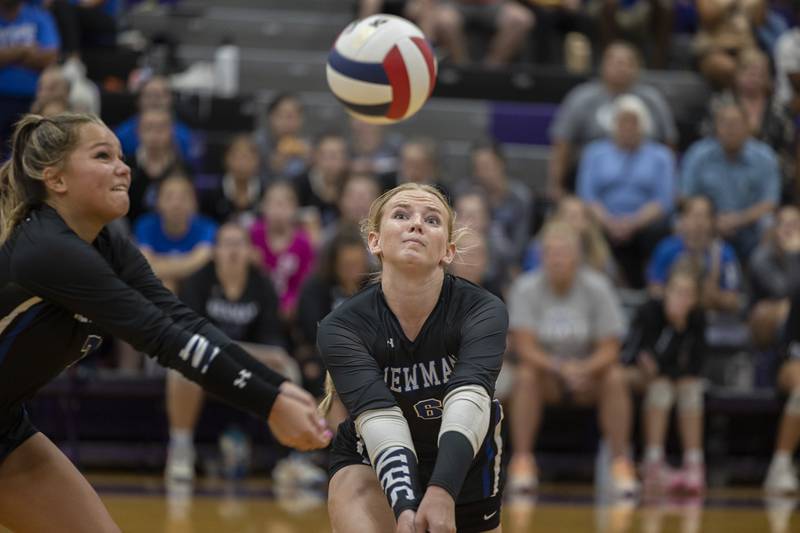 Newman’s Makenzie Duhon (left) and Jess Johns comes together to play a ball Monday, August 28, 2023 during a non-conference match-up in Dixon.