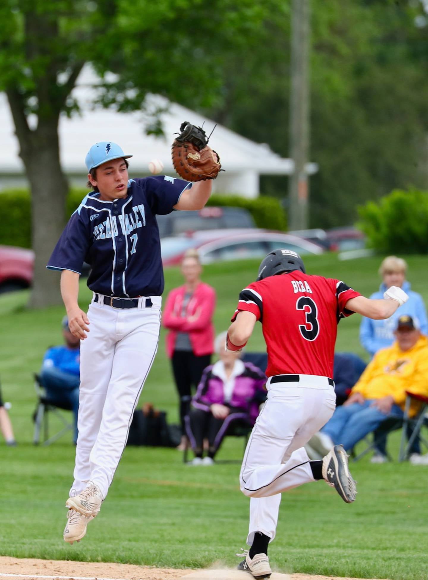 Bureau Valley first baseman Bryson Smith can't find the handle as E-P's Mikey Biba reaches safely Monday at Princeton.