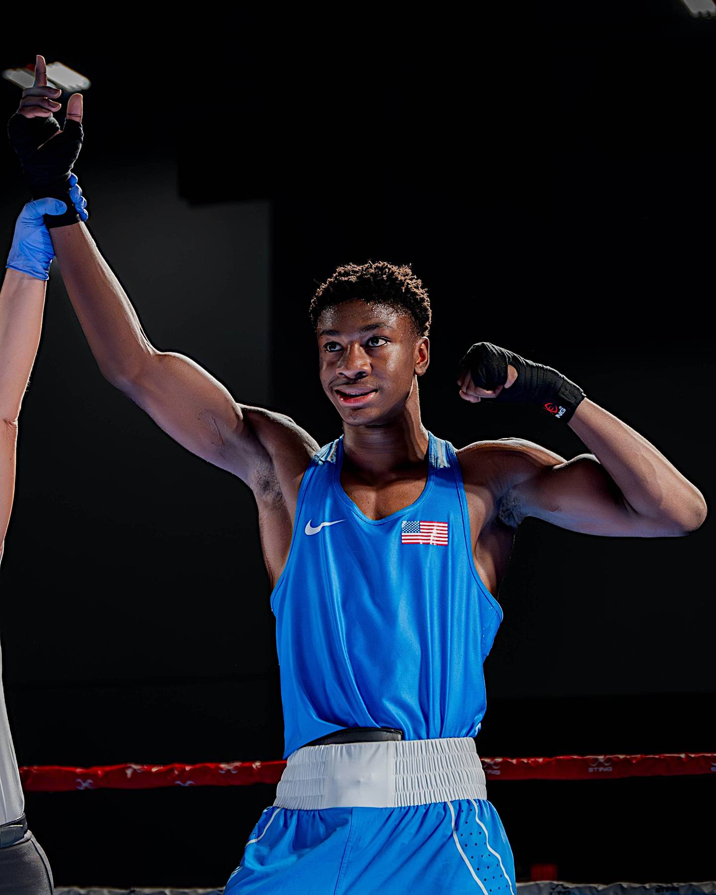 Joliet's JoJo Awinongya gets his hand raised after a win in a recent boxing tournament.