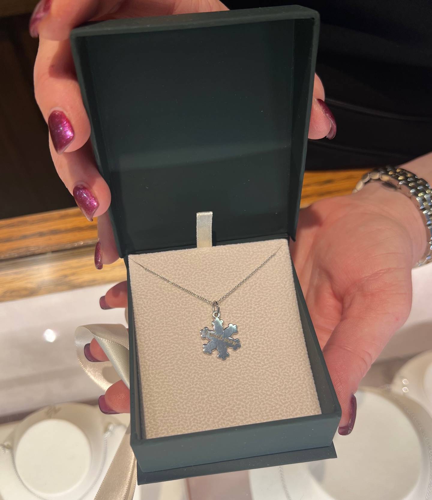 I Smell Snow necklace, designed by State Street Jewelers in Geneva, is one of the raffle prizes in the Gilmore Girls-themed bingo promotion through Nov. 24 in downtown Geneva.