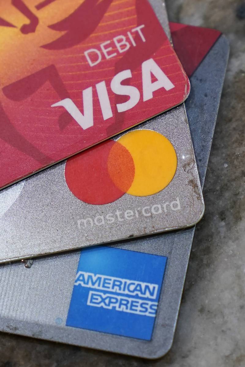 American Express, Visa and Master card cards on display in Richmond, Va., Thursday, July 1, 2021. U.S. consumer borrowing surged by $35.3 billion in May as Americans, bolstered by a reopening economy and rising job levels, went back to using credit in a big way. Borrowing on credit cards and for auto and student loans showed solid gains in May, the Federal Reserve reported Thursday, July 8, 2021. (AP Photo/Steve Helber, file)