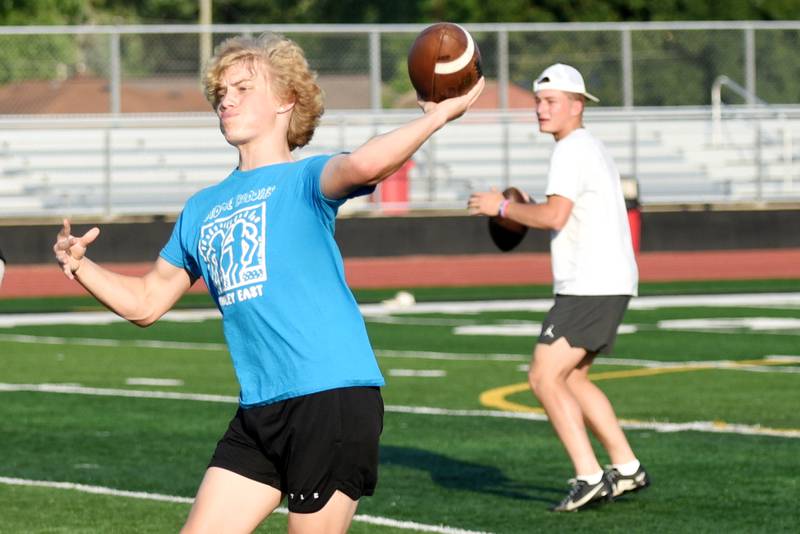 Colton Allen, left, a Bradley-Bourbonnais sophomore, and Ellis Johnson, a Boilermakers senior, work through a drill at the school's quarterback camp Wednesday, July 2, 2025.