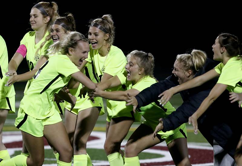 Richmond-Burton's Layne Frericks celebrates with her teammates after making a shoot-out goal against Johnsburg's Sophie Person during Kishwaukee River Conference Girls Soccer Tournament Championship Match Wednesday, May 3, 2023, at Richmond-Burton High School.