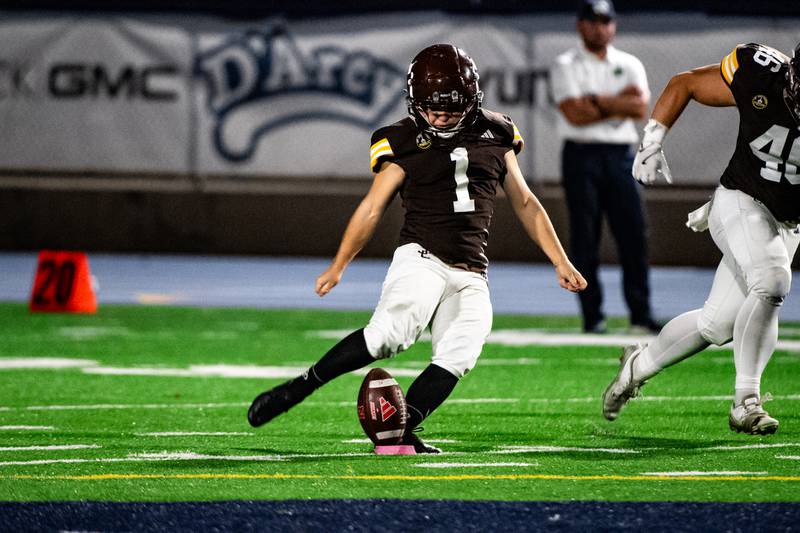 Joliet Catholic Academy's Vinny DiNovo kicks off during a game against Niles Notre Dame on Friday Oct. 3, 2025 at Busey Bank Field in Joliet