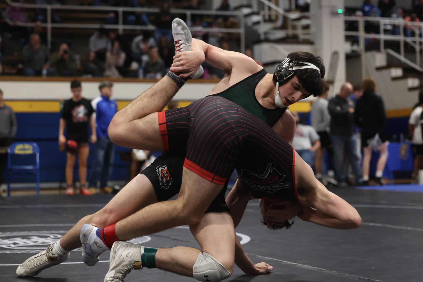 Plainfield East’s Niko Duggan drops Lincoln-Way Central’s Caden Harvey in the Joliet Central McLaughlin Classic on Saturday, Dec. 2, 2023 in Joliet.