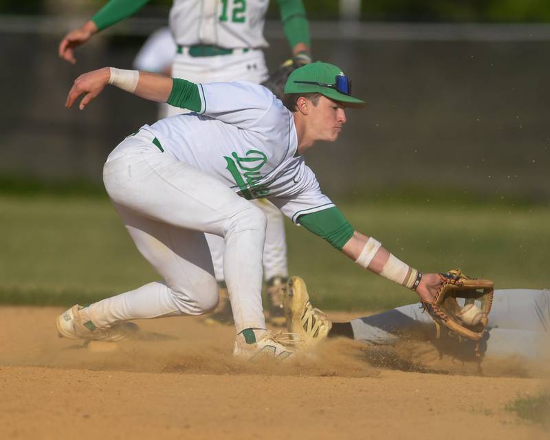 York's Luke Pieczynski (1) tags out Downers Grove North’s base runner during the game on Monday May 19, 2025, held at York High School in Elmhurst.