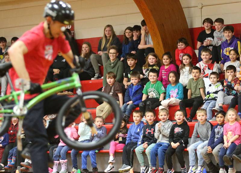Ladd Grade School students react as Matt Wilhelm, a national BMX Rider, Guinness World Record holder and America’s Got Talent semi-finalist performs tricks during an assembly on Monday, Jan. 13, 2024 at Ladd Grade School. Wilhelm, a three-time X Games medalist and two-time national champion, is a native to Oak Lawn. Wilhelm was bullied as a child. Today, he presents a strong message while speaking to children while focusing on kindness, positivity and the differences that one person can make.