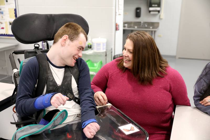 Anne Dragosh works with Tommy Loehrke at the Haines Center in St. Charles. Dragosh is the St. Charles District 303 Transition Program coordinator.