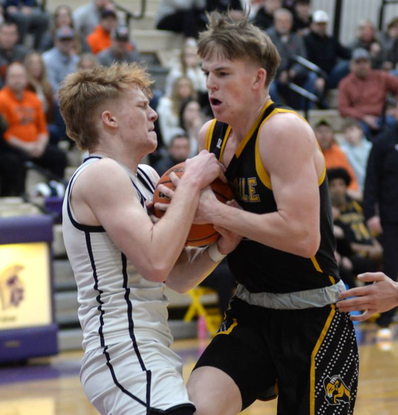 Byron's Jack Hiveley (left) ties up Riverdale's Jake Willems (2) as he tries to drive to the basket at the 2A Mendota Sectional on Wednesday, Feb. 28, 2024 held at Mendota High School.