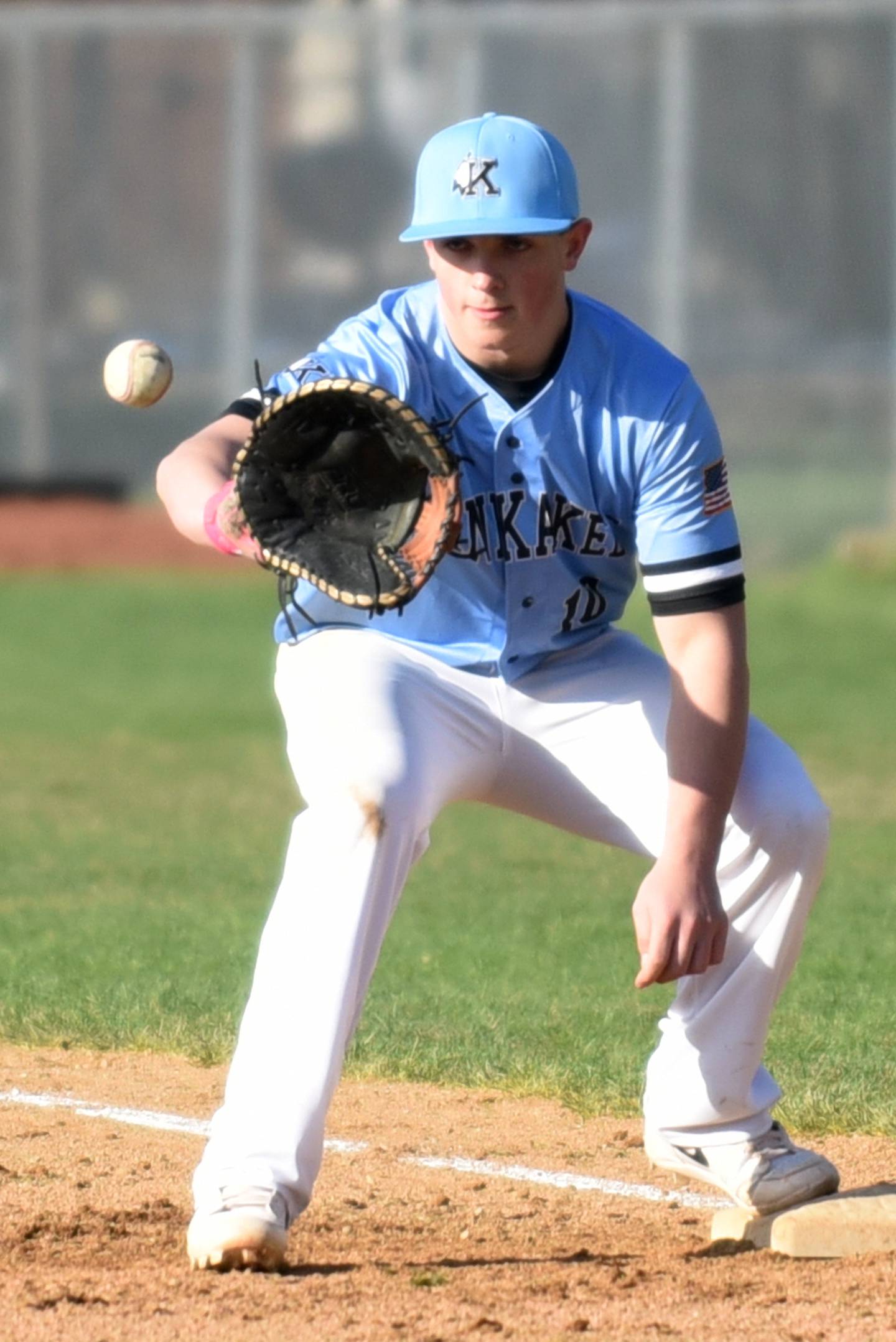 Kankakee's Jacob Vinardi fields a throw at first base during a game at Bradley-Bourbonnais Monday, March 31, 2025.
