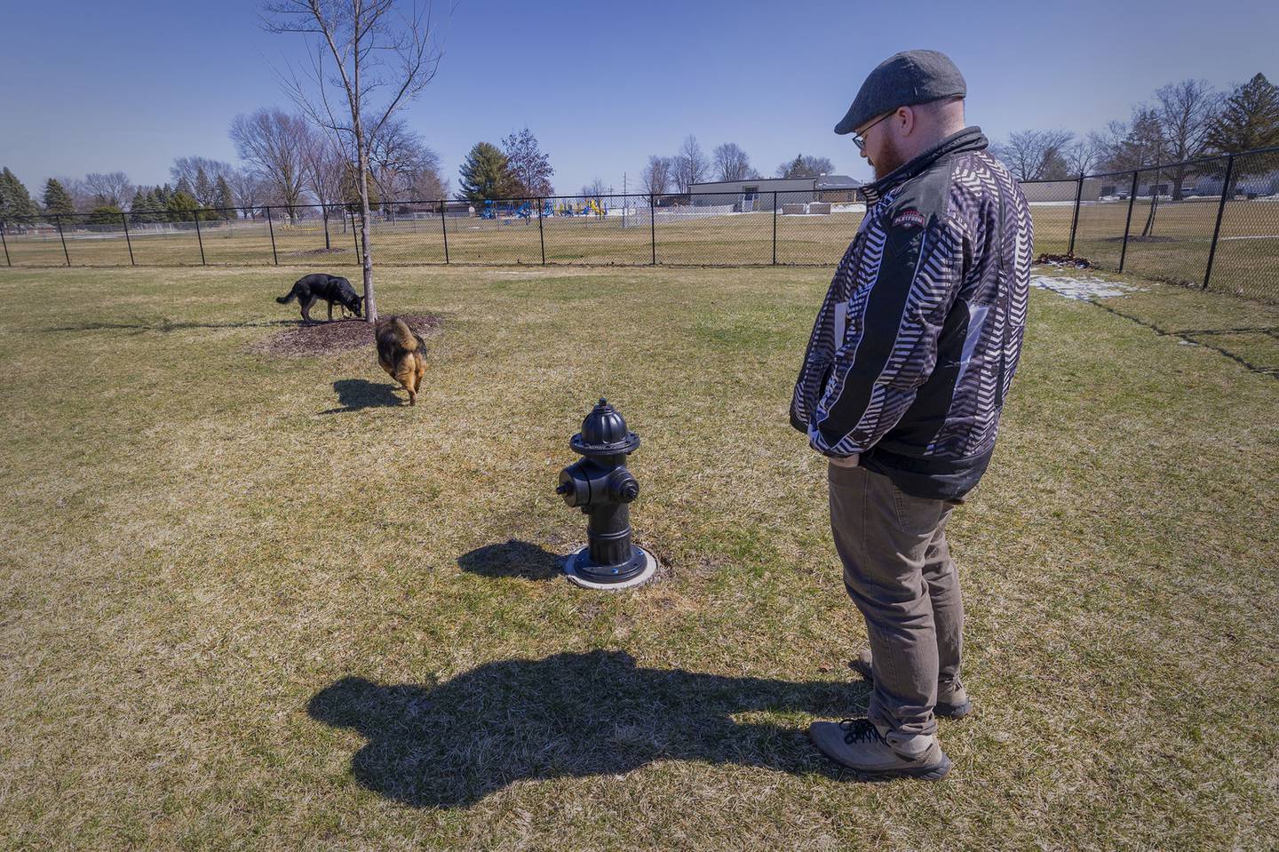 Marshall Doane takes his two pooches Raven and Cyrus to Dogwood Acres Thursday, March 19, 2026, in Sterling. Doane, an advocate for the dog park, helped secure every dog’s favorite “watering hole,” a fire hydrant. CIMCO donated a pair of the destined for the scrap-heap hydrants to the park, one for the small dog area and one for the larger pups.