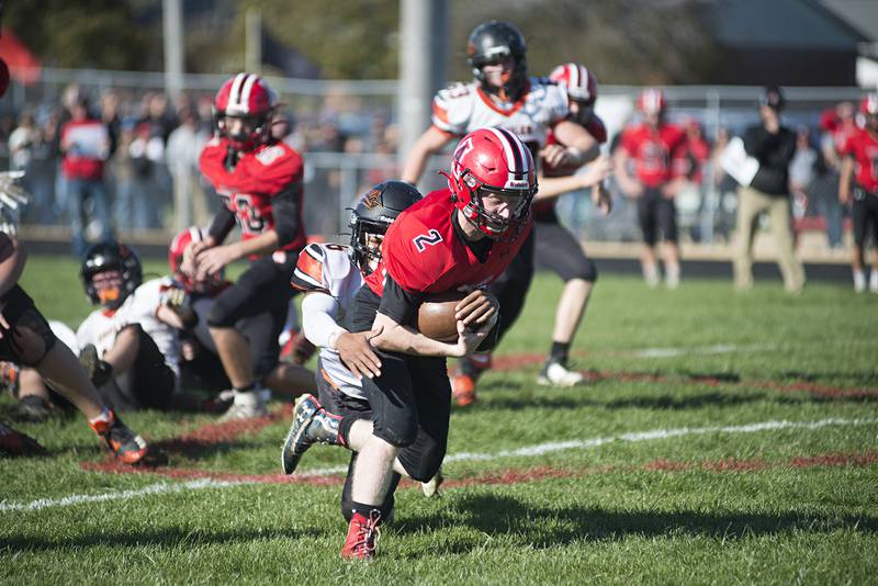 Amboy’s Dylan Daniels is hauled down by Milledgeville’s Izaac Toms-Smith Saturday, Nov. 6, 2021 in Amboy.