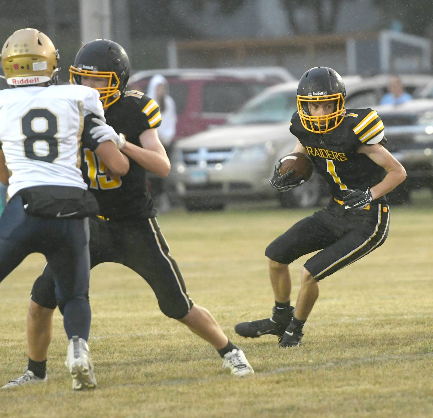 AFC's Zane Murphy looks for hole in the line as Auden Polk( 19) blocks Polo's Tyler Meridian.