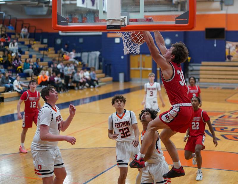 Yorkville's Bryce Salek (30) dunks the ball against Oswego during a basketball game at Oswego High School on Saturday, Jan 27, 2024.