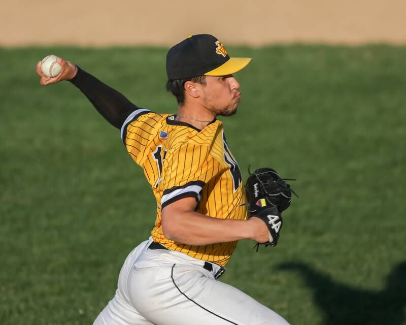 Joliet West's Brandon Alzamora (12) delivers a pitch during varsity baseball game between Oswego East at Joliet West.  April 10, 2023.