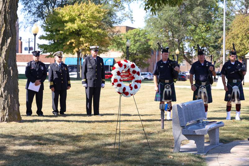 A wreath awaits placement at the memorial wall during the 44th Kankakee County Fallen Firefighter Memorial Service on Friday, Oct. 3, 2025.