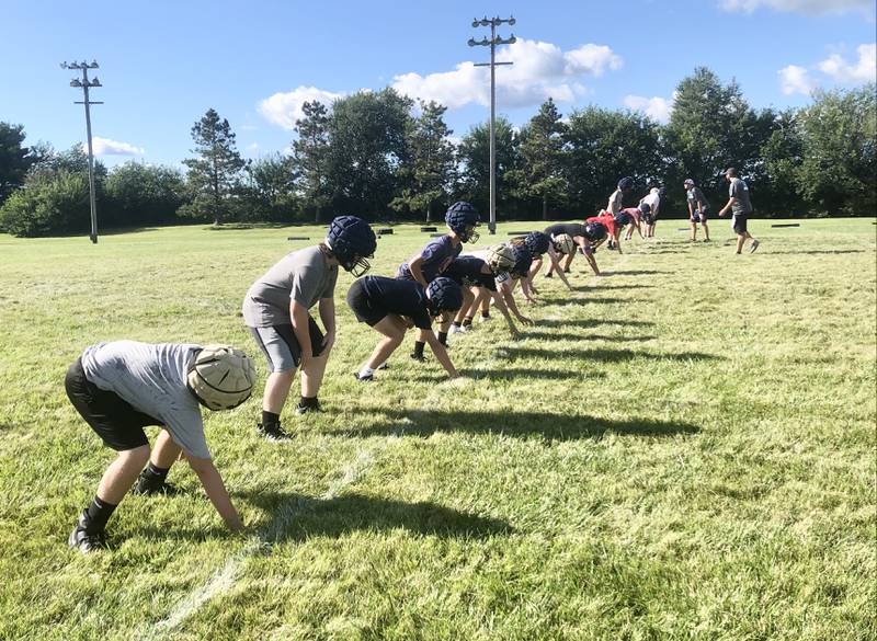 The Bureau Valley Storm run drills during Tuesday's football practice at Bourquin Field in Manlius.