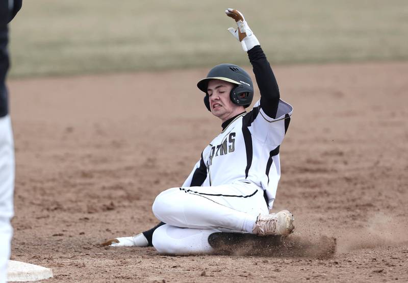 Sycamore's Conner Williar slides safely in with a triple during their game against Burlington Central Tuesday, March 21, 2023, at Sycamore Community Park.