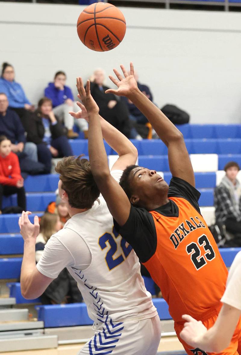 DeKalb’s Davon Grant and Lyons Township's Brady Chambers go after a rebound Monday, Jan. 15, 2023, during their game in the Burlington Central Martin Luther King Jr. boys basketball tournament.