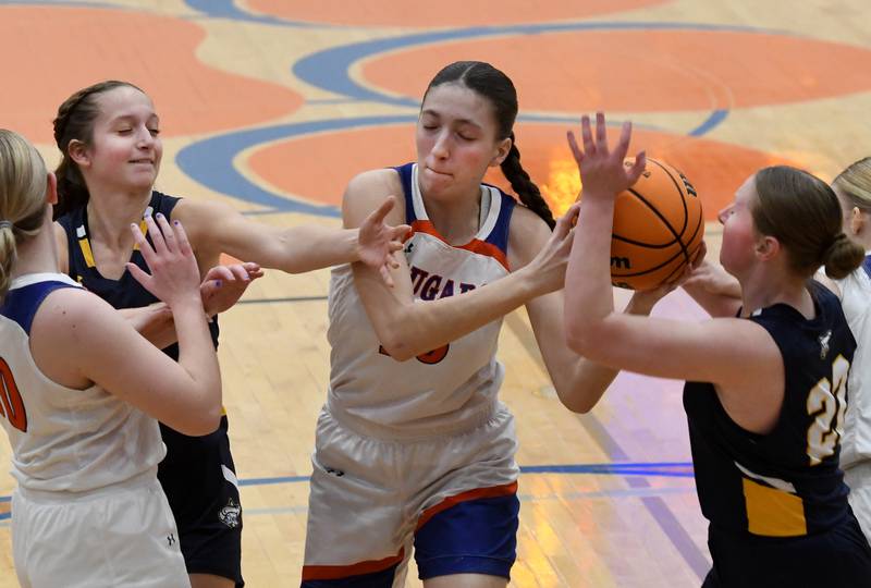Eastland's Vanessa Allen (15) pulls the ball away from Polo's Laynie Mandrell (2) and Avalyn Henry (22) on Tuesday, Feb. 10, 2026 at Eastland High School in Lanark.