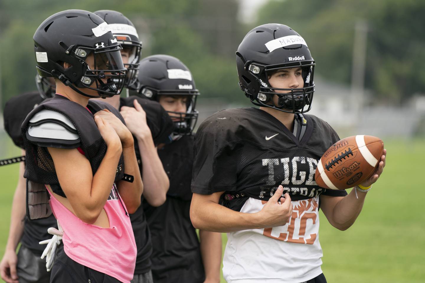 Crystal Lake Central's Jacob Carnrite (left) and quaterback Colton Madura during practice for the Crystal Lake Central varsity football team on Wednesday, July 21 at Crystal Lake Central High School in Crystal Lake.