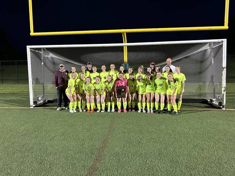 The Richmond-Burton girls soccer team poses with its plaque after winning the Class 1A Cristo Rey St. Martin Regional in Waukegan on Friday.