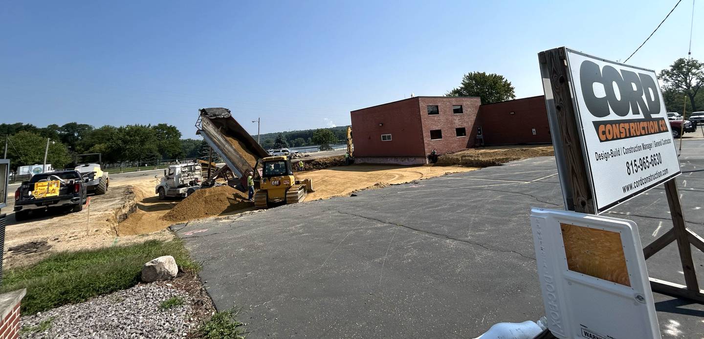 A Martin & Co truck deposits rock as construction continues on the new expansion of the Oregon Fire Station on Tuesday, Aug. 5, 2025. The addition is located just west of the current station at 100 ashington St. in Oregon. Cord Construction Co. is  the contractor for the project.