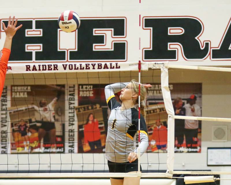 Joliet West's Emma Salerno (1) leaps high for a spike attempt during Class 4A Bolingbrook Sectional semifinal match between Joliet West at Oswego.  Nov 5, 2024  in Bolingbrook.
