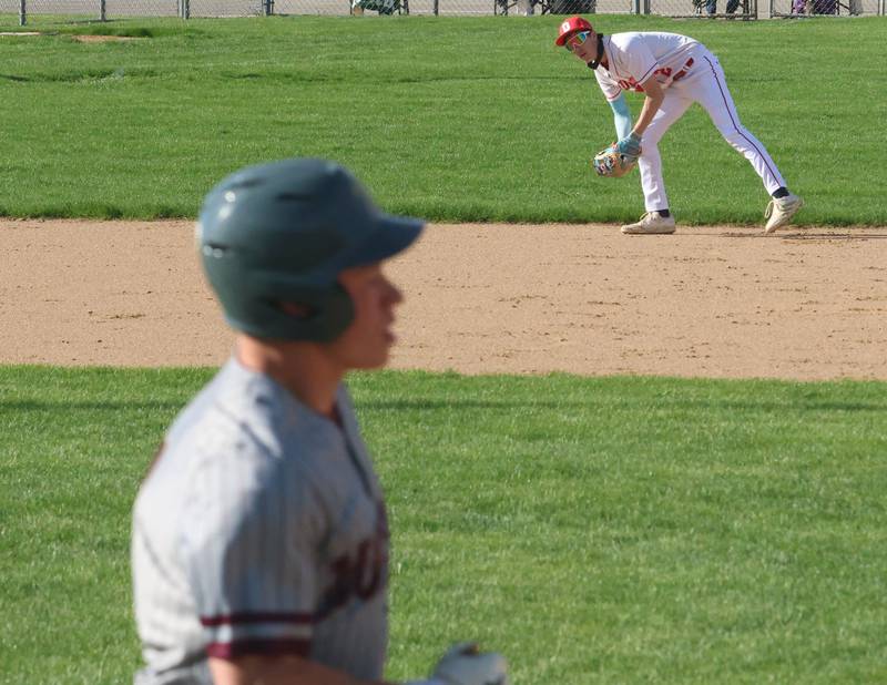Ottawa's Colt Bryson makes an error as Morris's Logan Conroy reaches first base on Monday, April 20, 2026 at Ottawa High School.