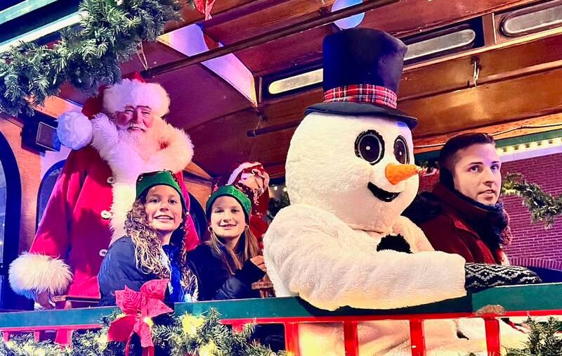 Santa Claus rides in a trolley during the annual Christmas Parade on Friday, Dec. 6, 2024 in Princeton.