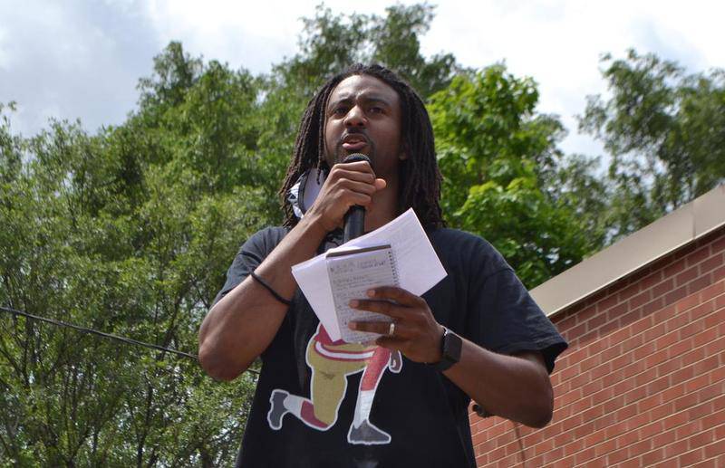 Joliet Central High School teacher Ernest Crim speaks to a crowd at a Black business expo on June 27, 2020. Crim highlighted the need for people to challenge systemic racism amid several high profile deaths of African Americans at the hands of law enforcement.