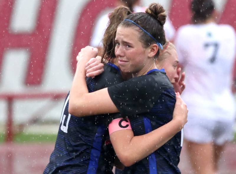 Burlington Central players hug after their third place game loss to Peoria Notre Dame Saturday, June 1, 2024, at the IHSA Class 2A state soccer finals at North Central College in Naperville.